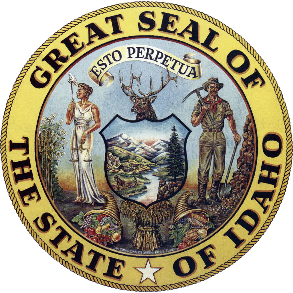 A round seal with the words Great Seal of the State of Idaho surrounding a painting of lady justice and a miner standing on either side of a shield painted with a landscape of mountains and rivers. Above the shield is the head of a deer with large antlers, and in front lay two cornucopias full of fruit and a bundle of hay.
