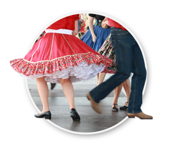 A group of people square dancing. The official state dance of Idaho.